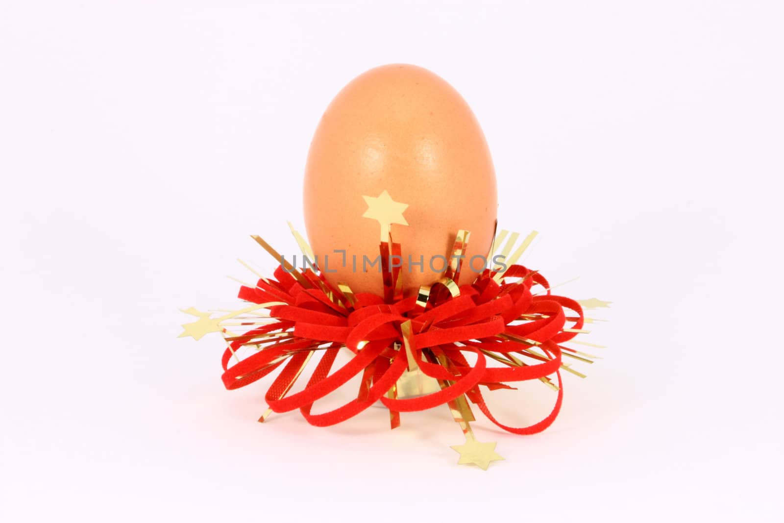 Chicken egg with red and gold decorations
