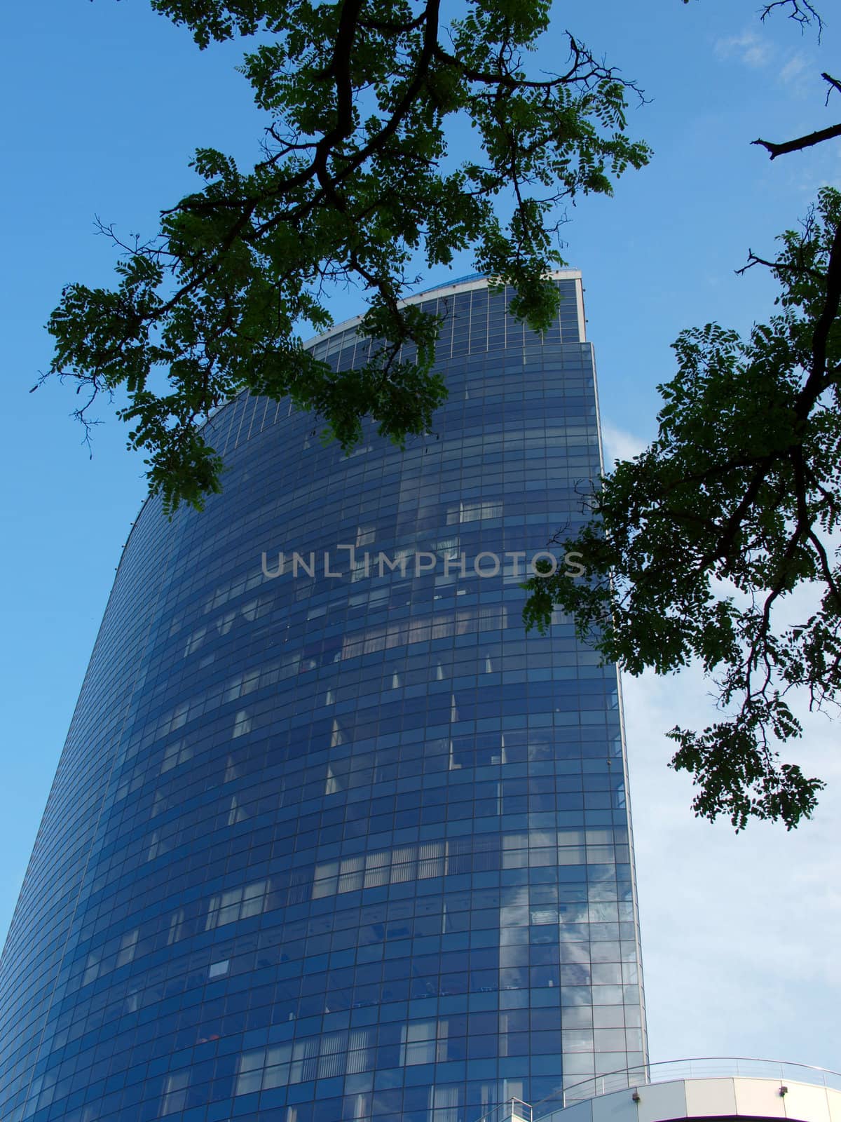 A skyscraper made of glass and concrete