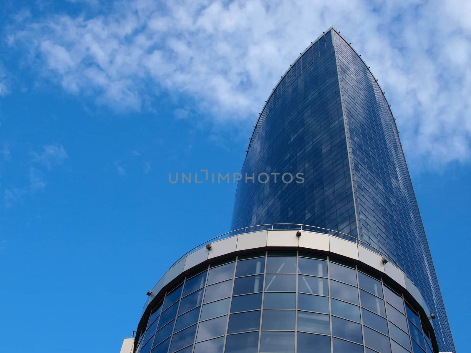 A skyscraper made of glass and concrete