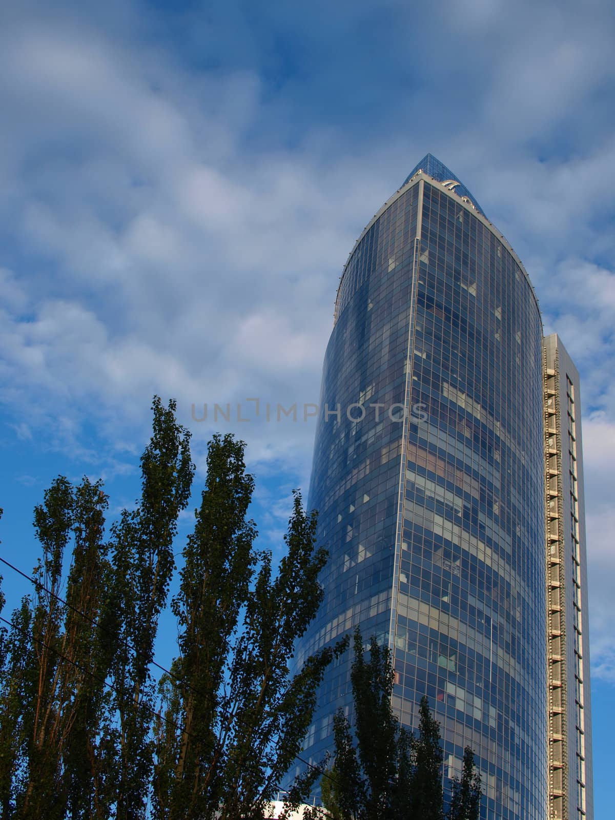 A skyscraper made of glass and concrete