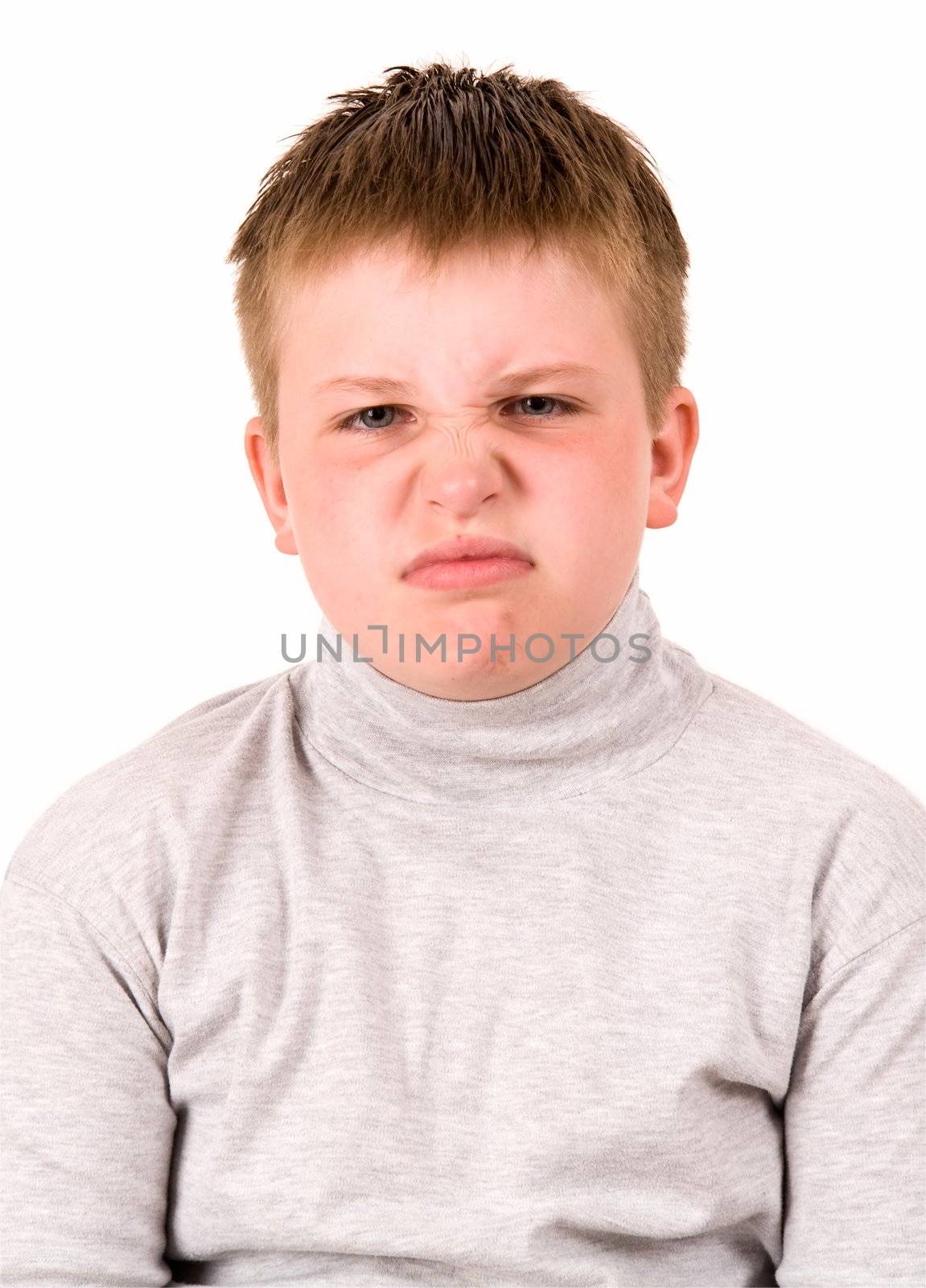 angry little boy on a white background