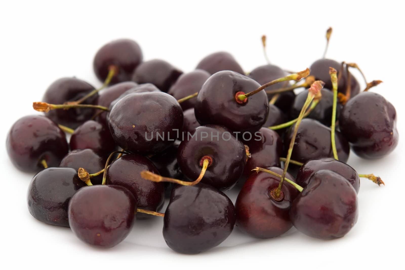 Ripe sweet cherry on a white background