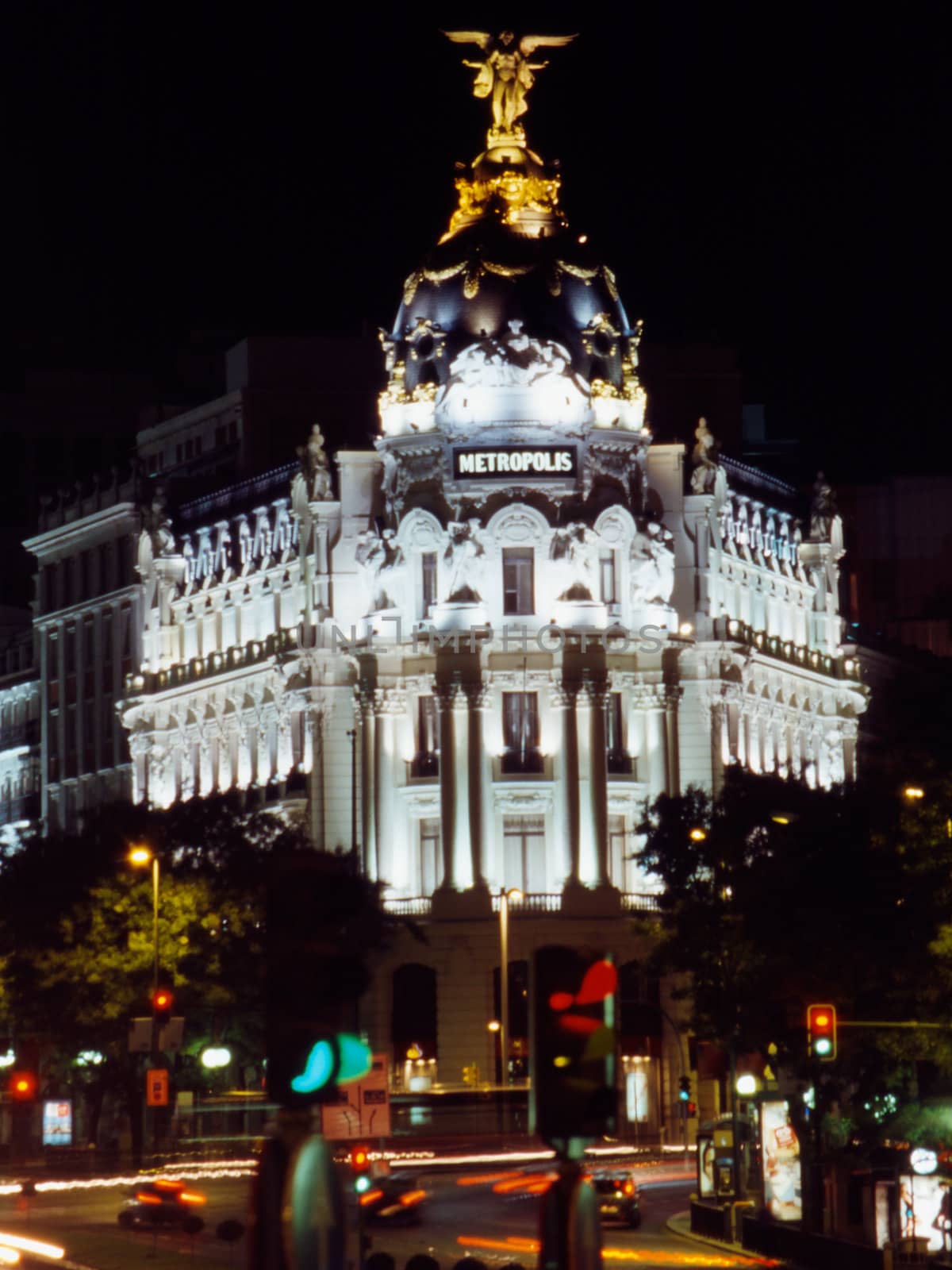 Night traffic in the avenue in front of Metropolis palace