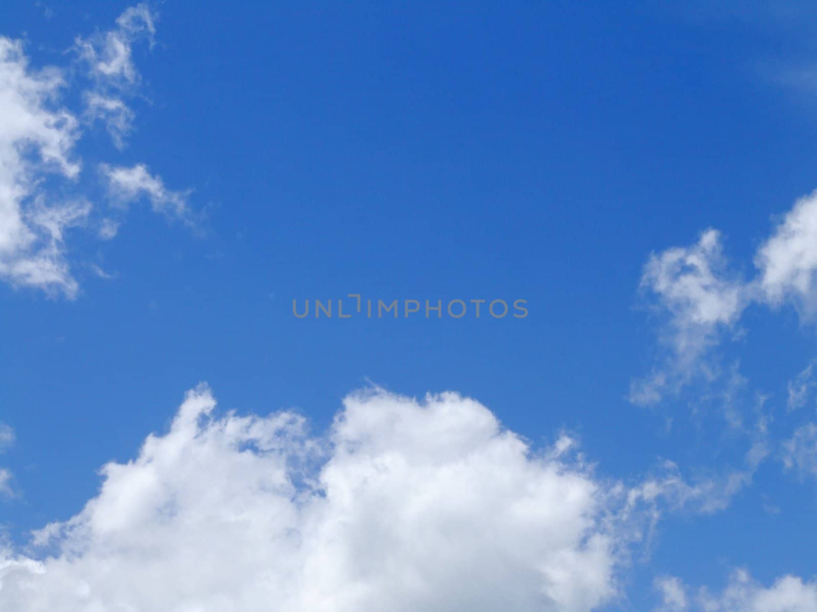 white clouds in a blue sky