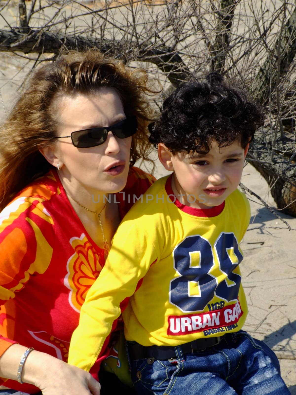 Mother and child talking on the beach