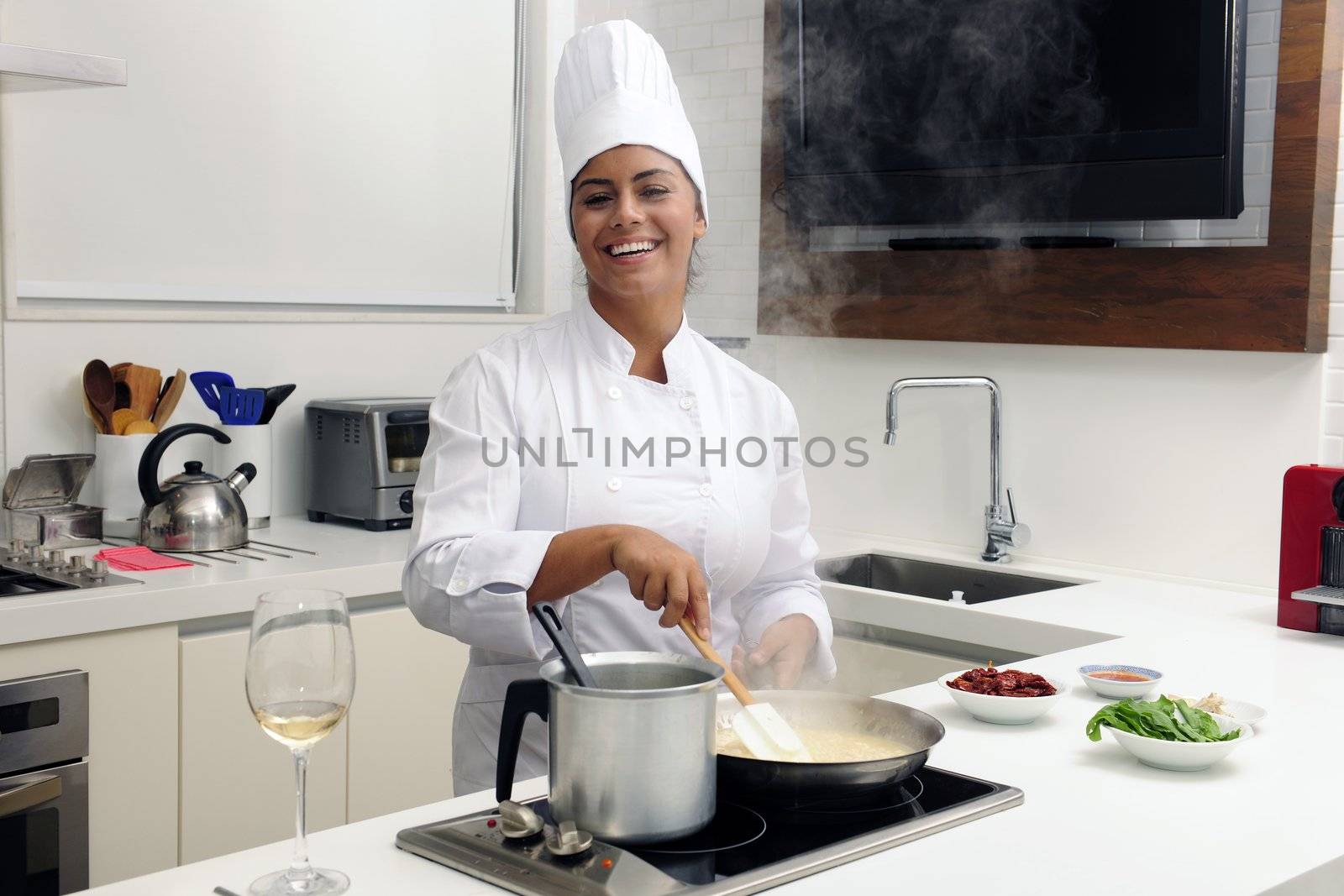 Chef cooking risotto stirring with ladle