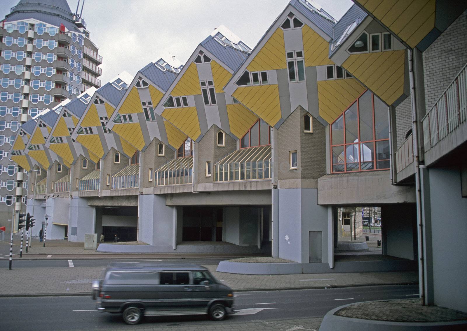 Van driving under the Rotterdam Cube Houses.