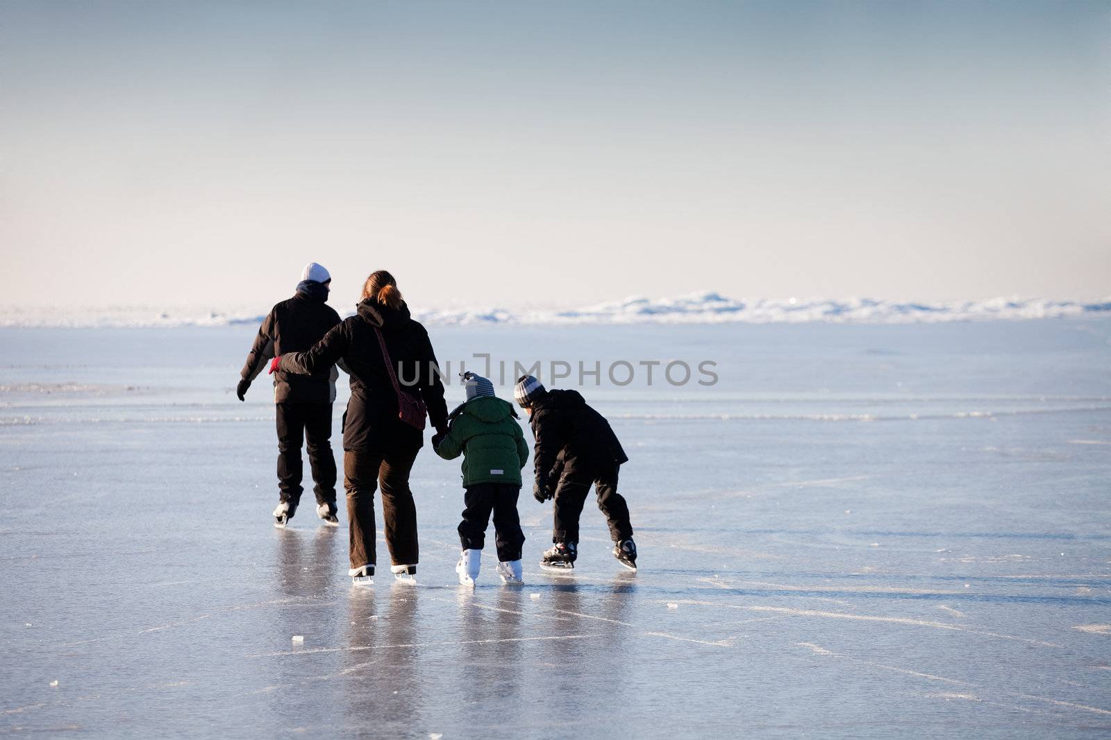 Family ice skating by ints