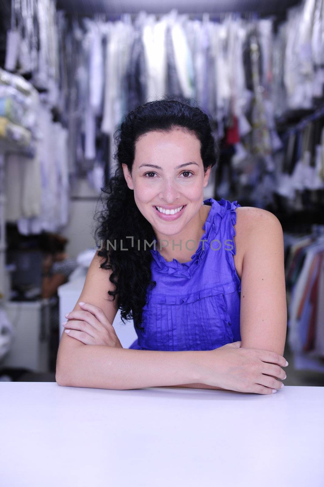 small business: happy owner of a dry cleaner store