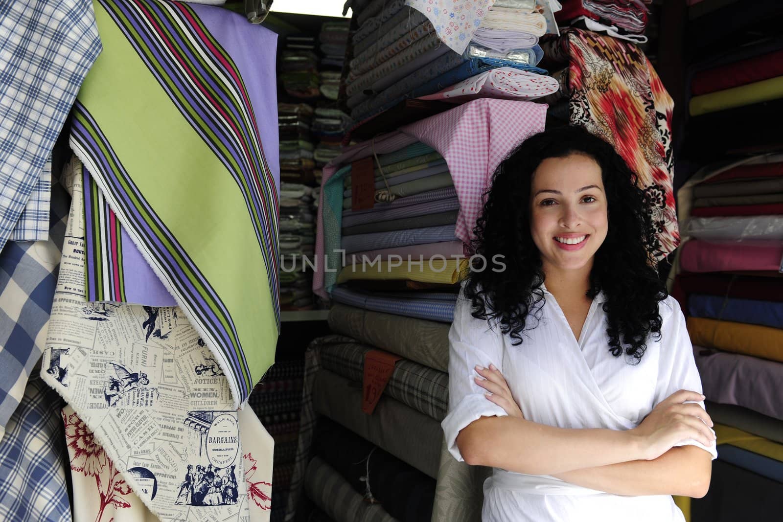 small business: happy owner of a fabric store