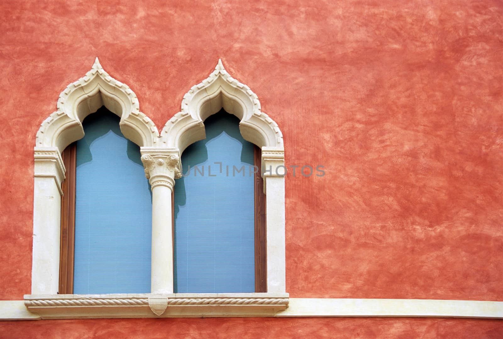 Oranate windows decorate a Verona home.