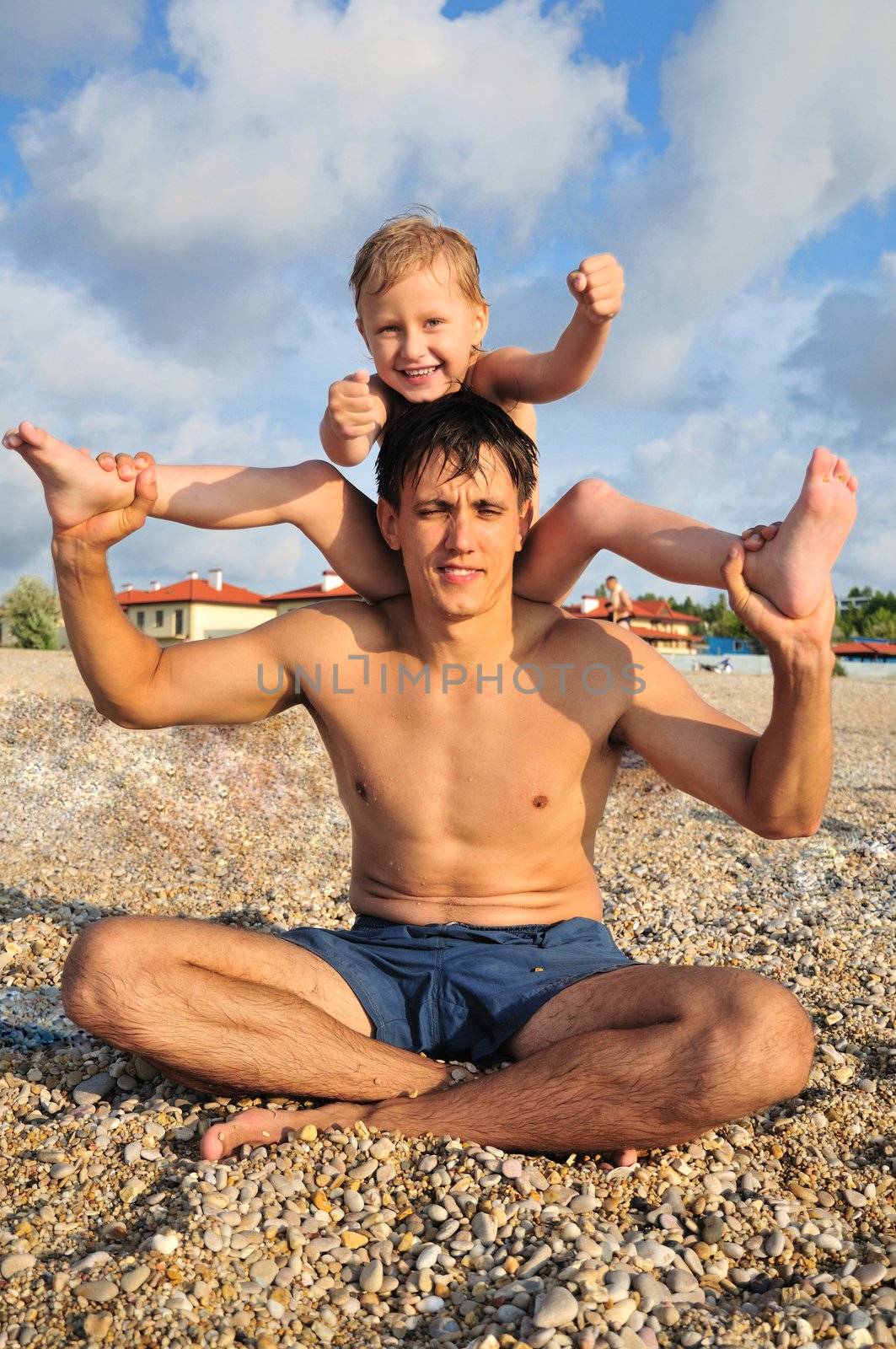 father and son have a fun at the beach
