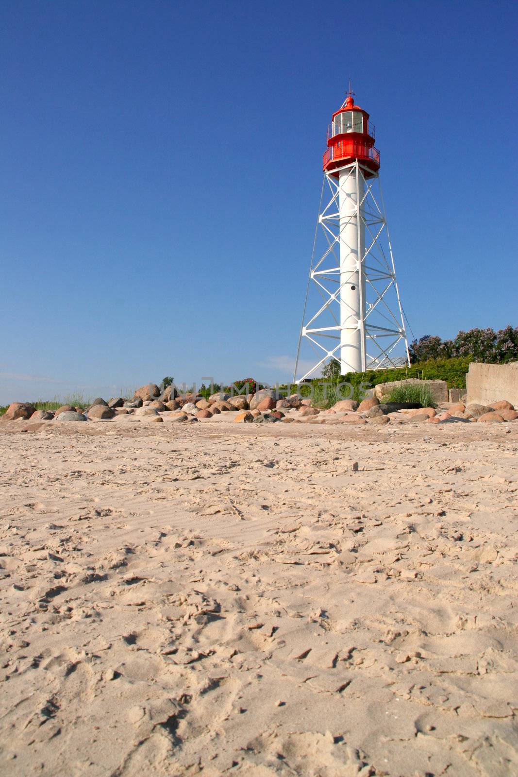 footprinted beach sand by the white lighhouse, Rucava, Latvia