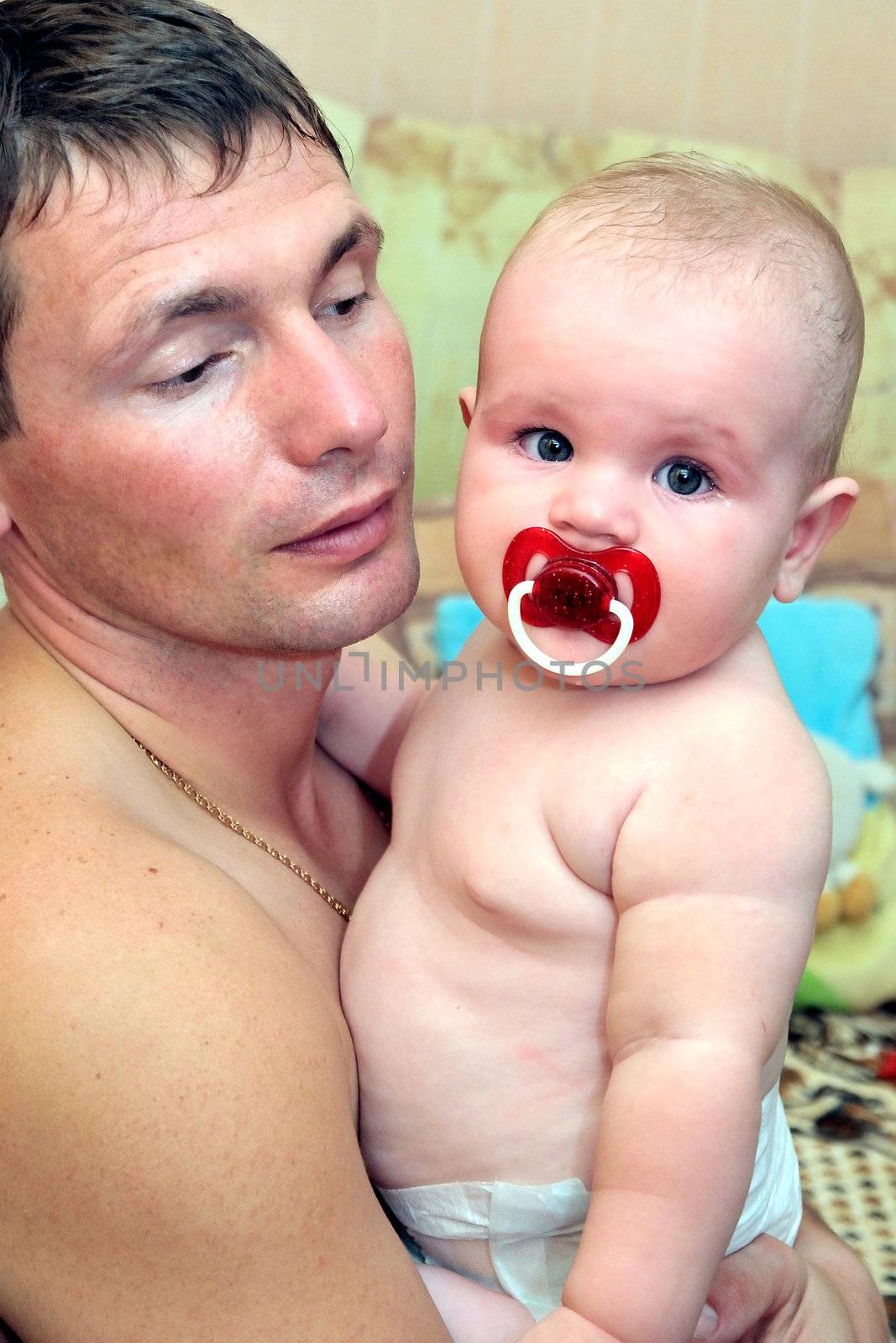 father calming his crying  baby girl  down