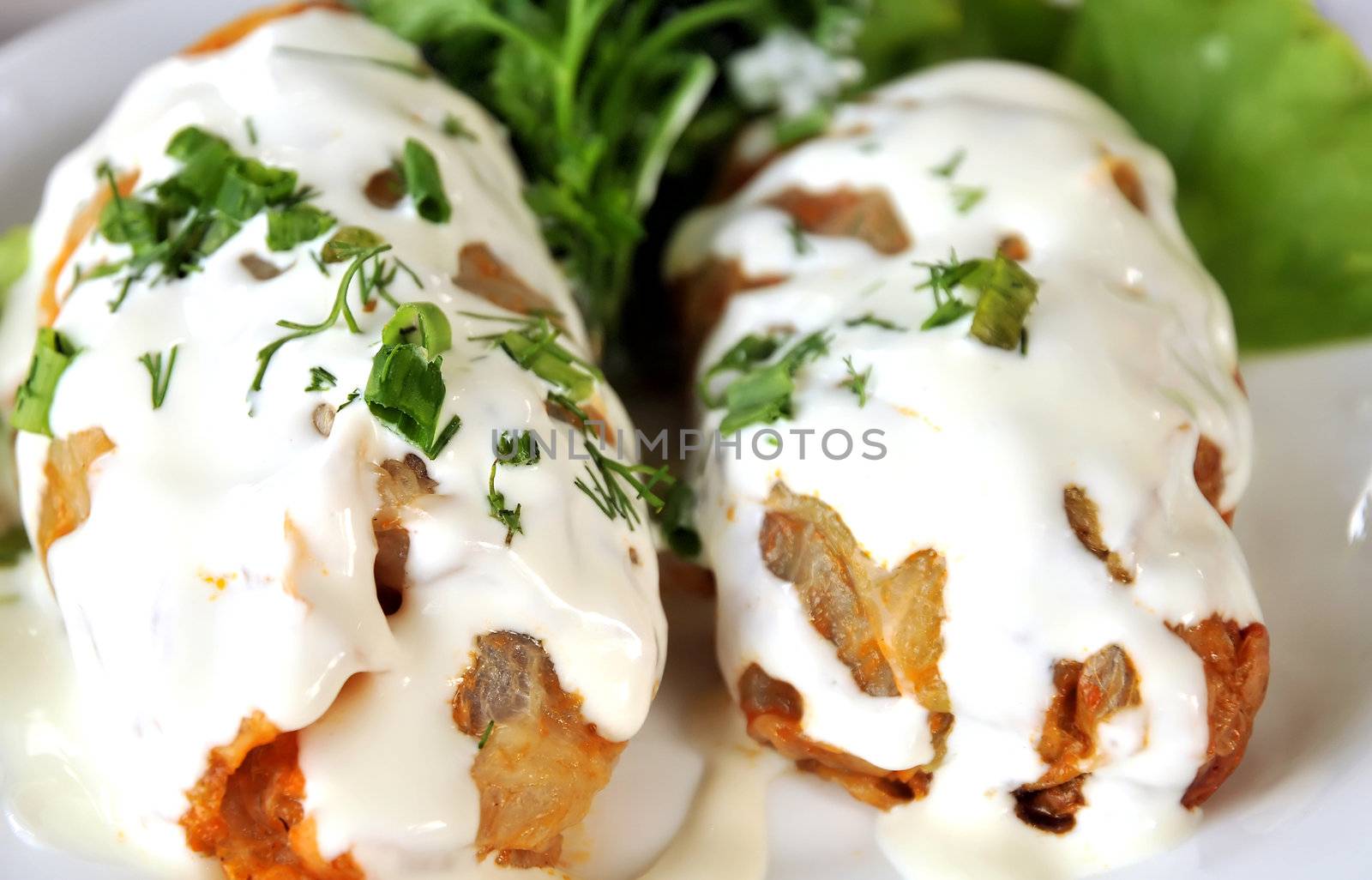stuffed cabbage leaves  with  meat and rice and  sour cream 