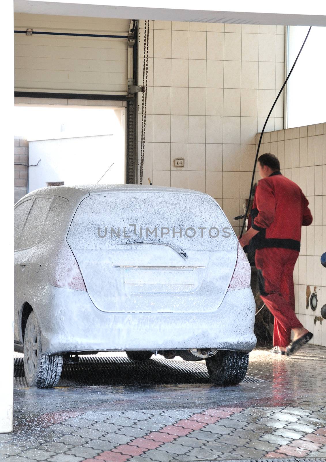 washerman washing Car at Car-wash service 
