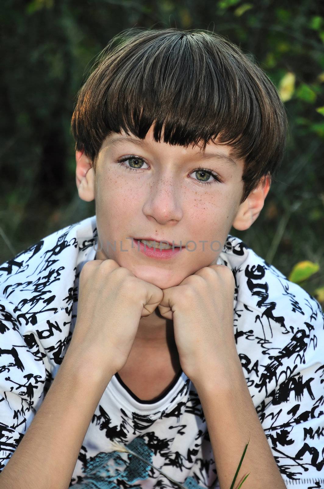 freckled teenage boy looking at the camera