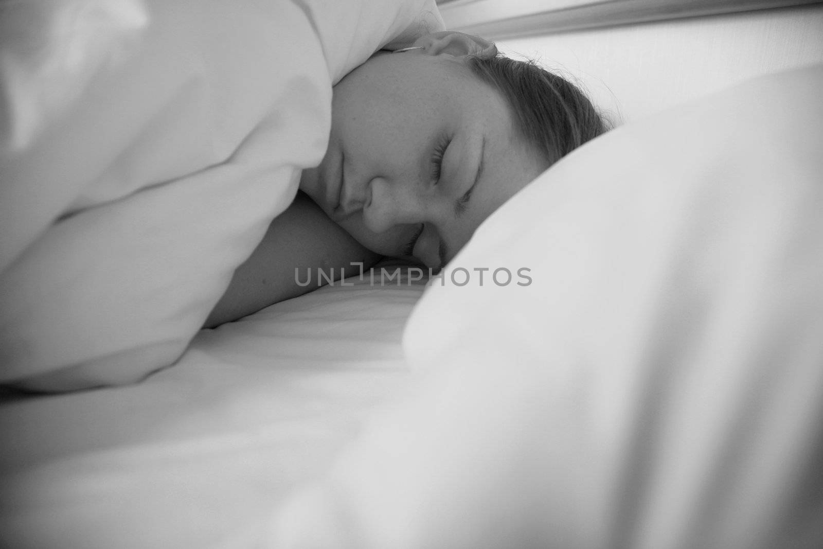 woman sleeping in pillows