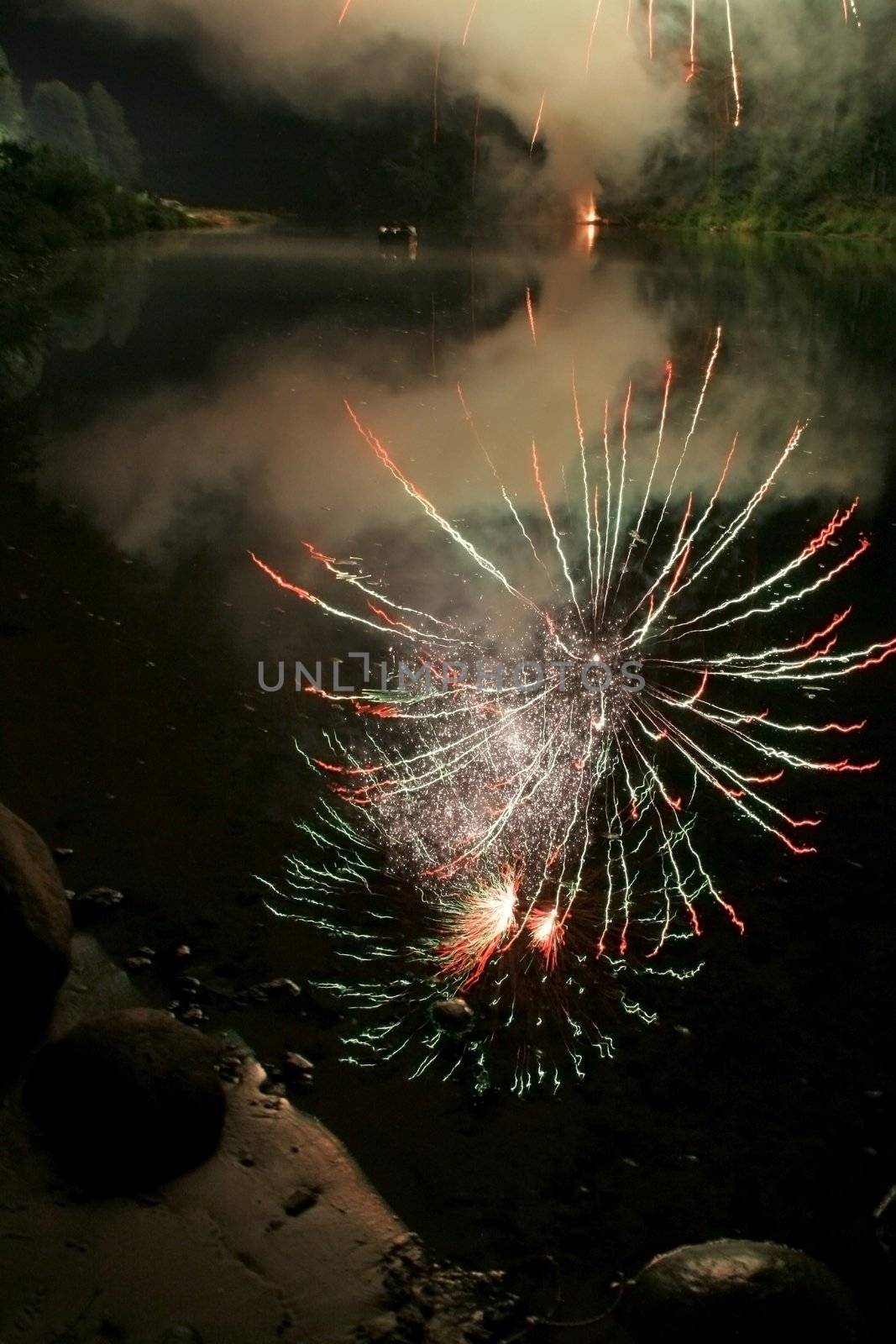 firework reflections on river