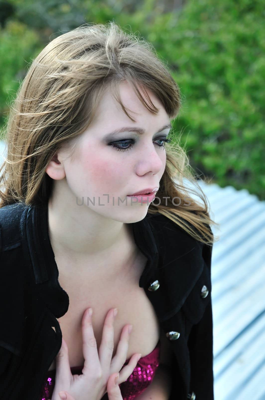 portrait of beautiful fashion girl over green