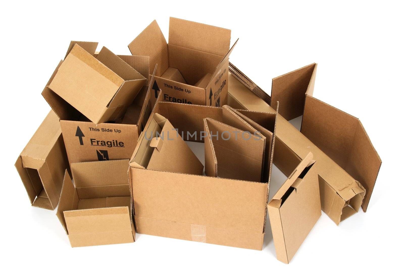 Pile of open cardboard boxes on white background.