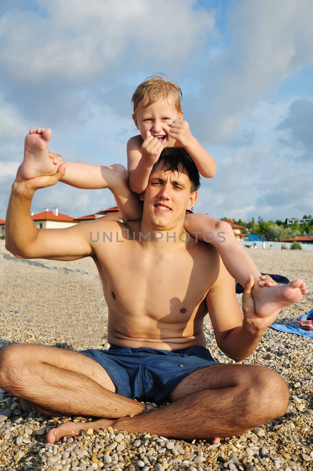 father and son have a fun at the beach
