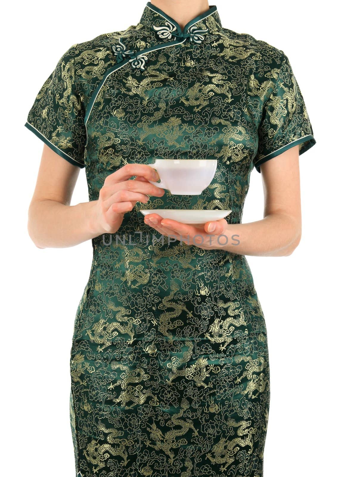 Woman in green Chinese dress holding a cup of tea.