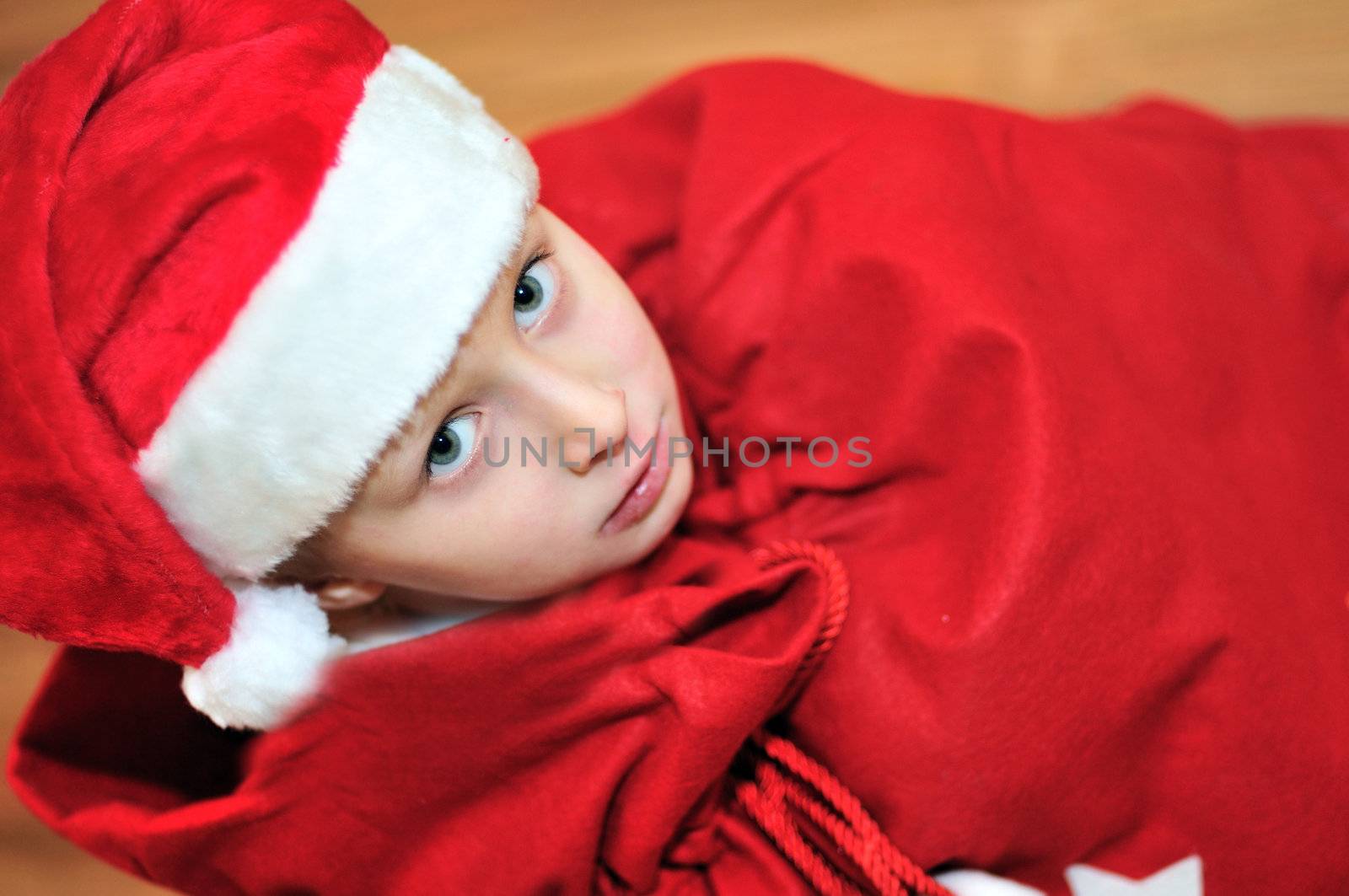 present from Santa - little Santa helper in red bag