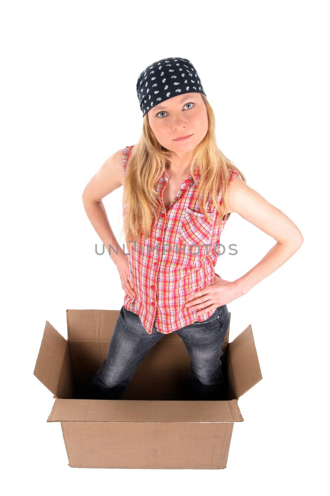 Girl standing in a cardboard box, looking up. Isolated on white.