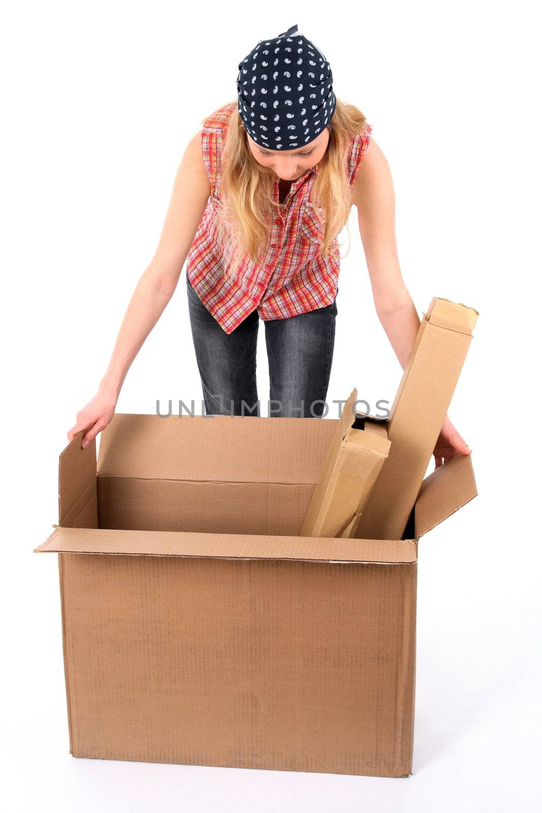 Young woman checking the contents of a cardboard box.