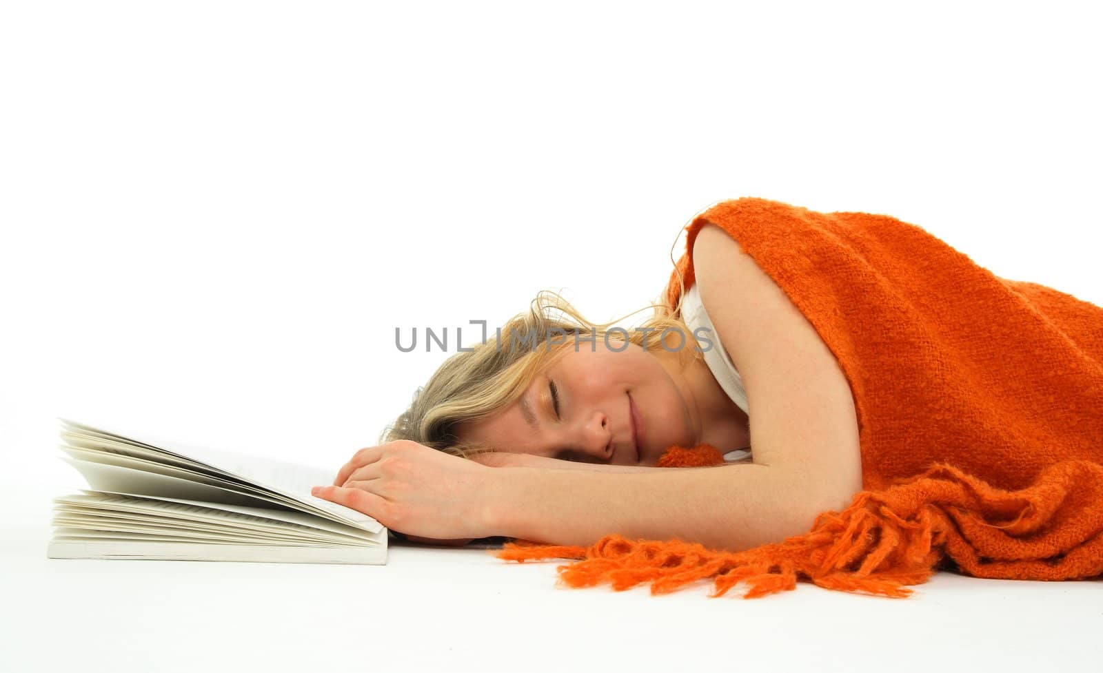 Cute girl fallen asleep with an open book.