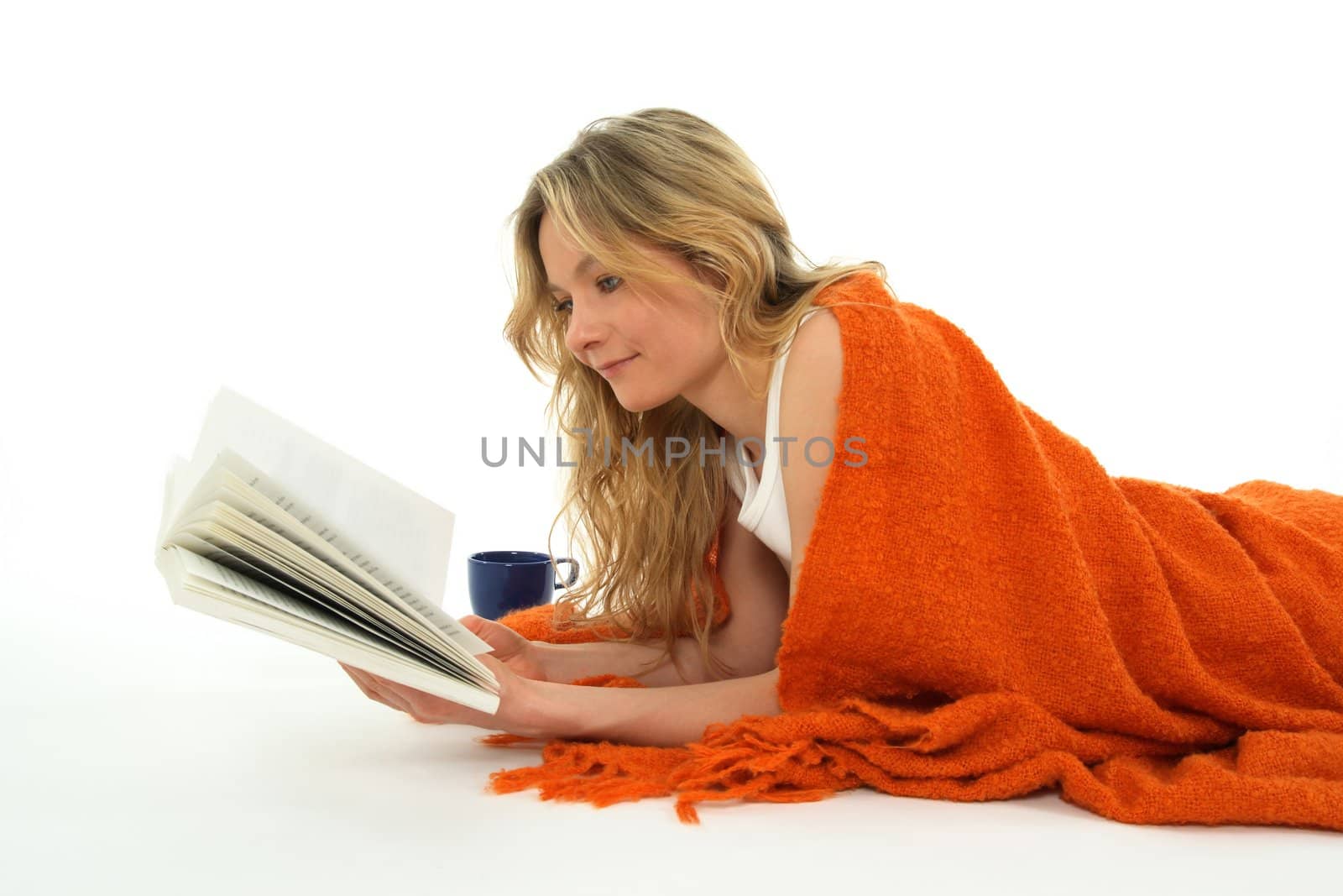 Nice cozy girl reading a book, relaxed.