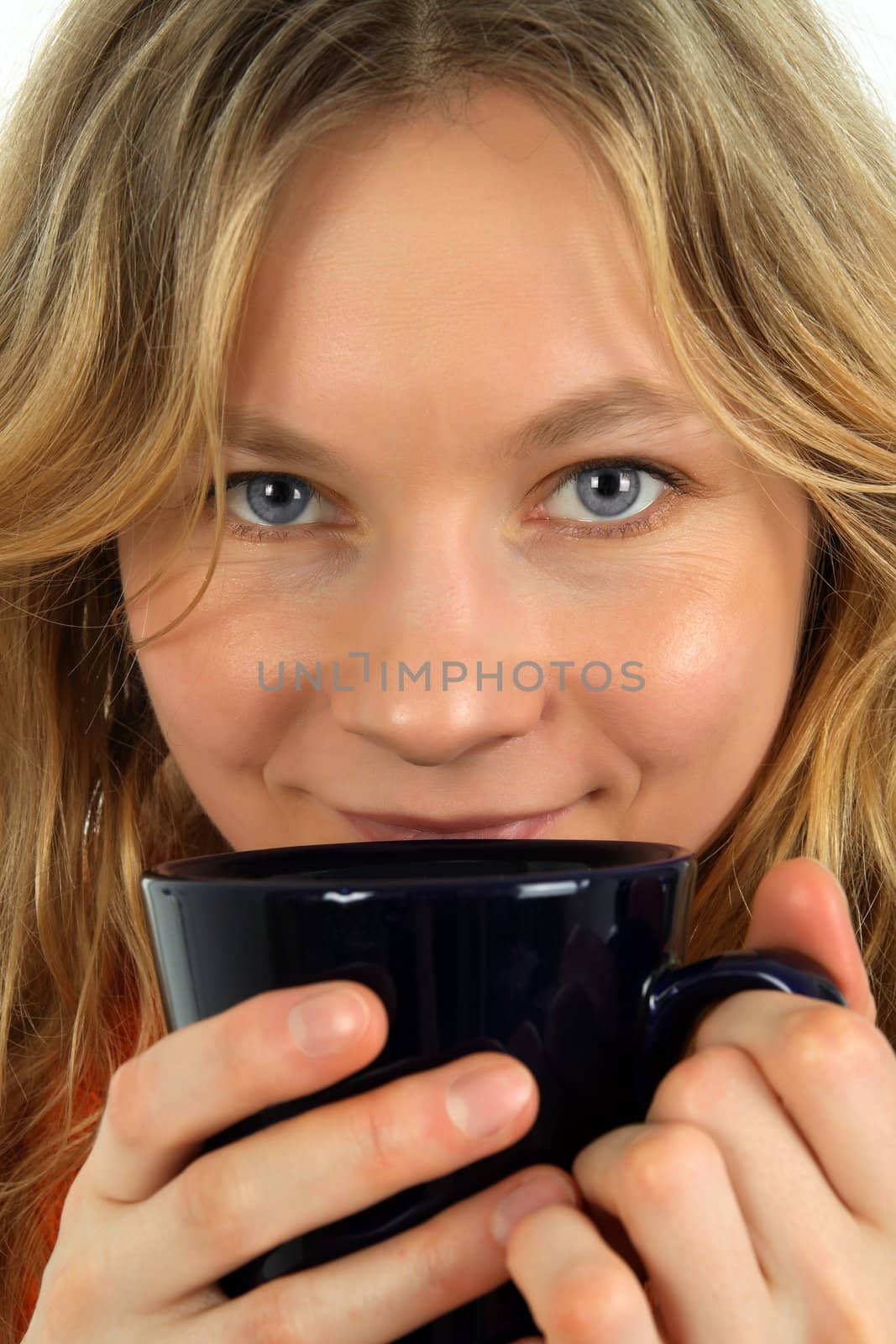 Charming young woman drinking tea by anikasalsera