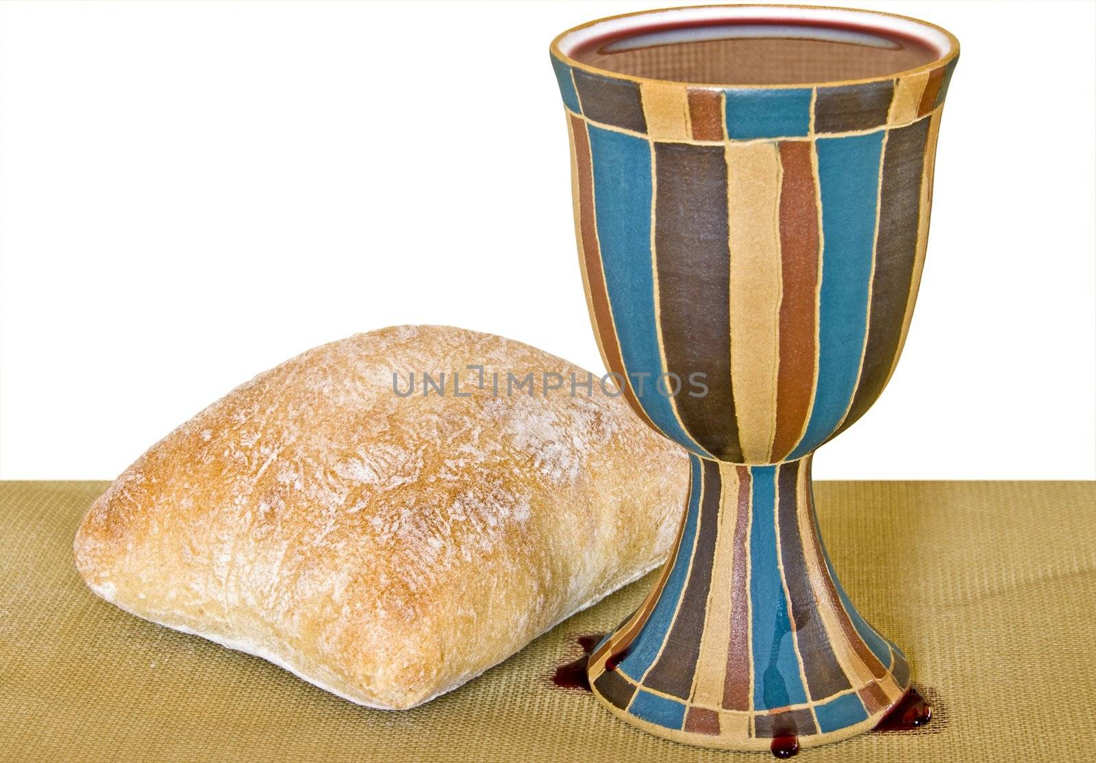 Wine and bread for holy communion. Includes clipping path for white background.