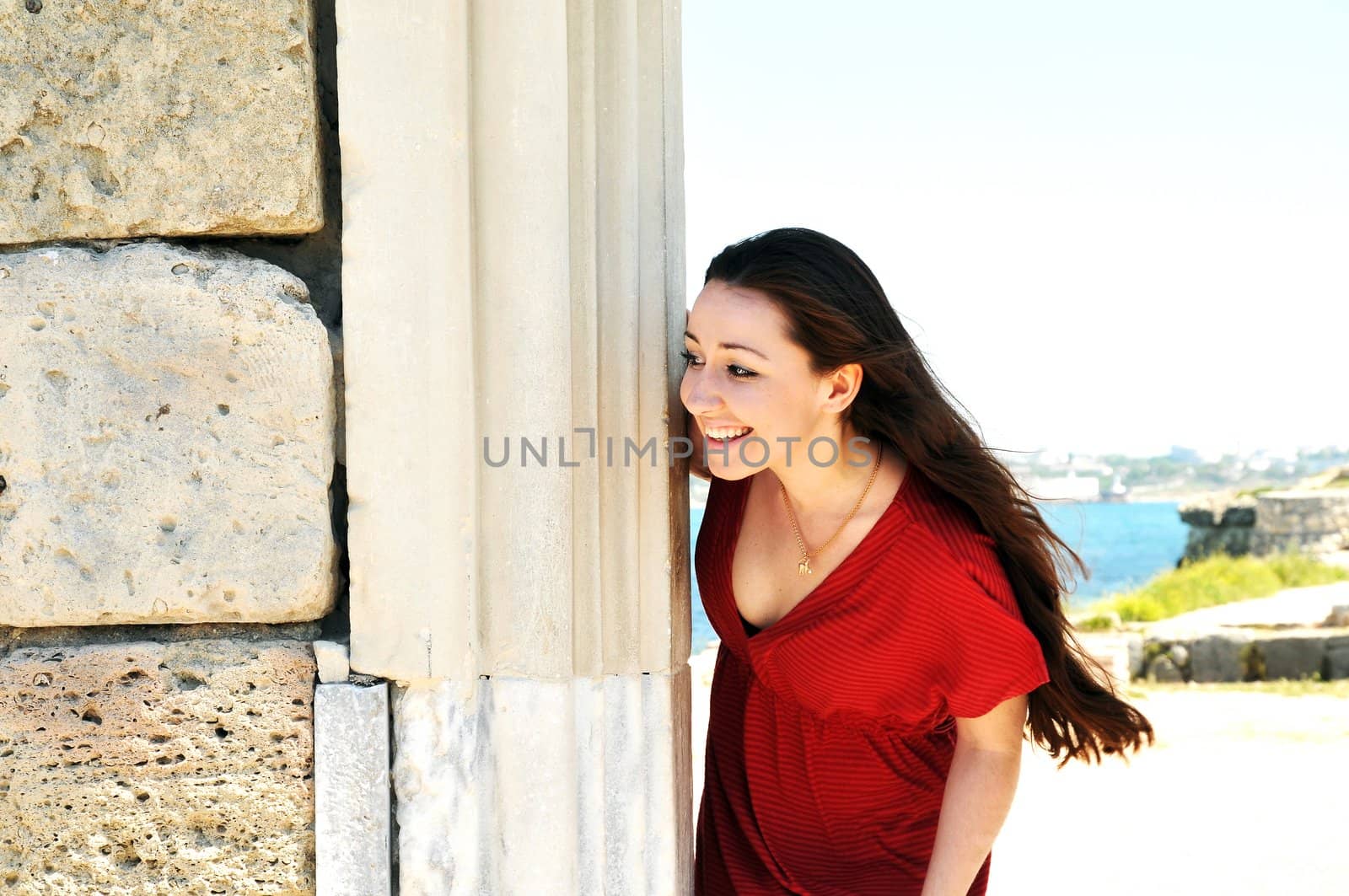 brunette in the ancient town has seen something funny