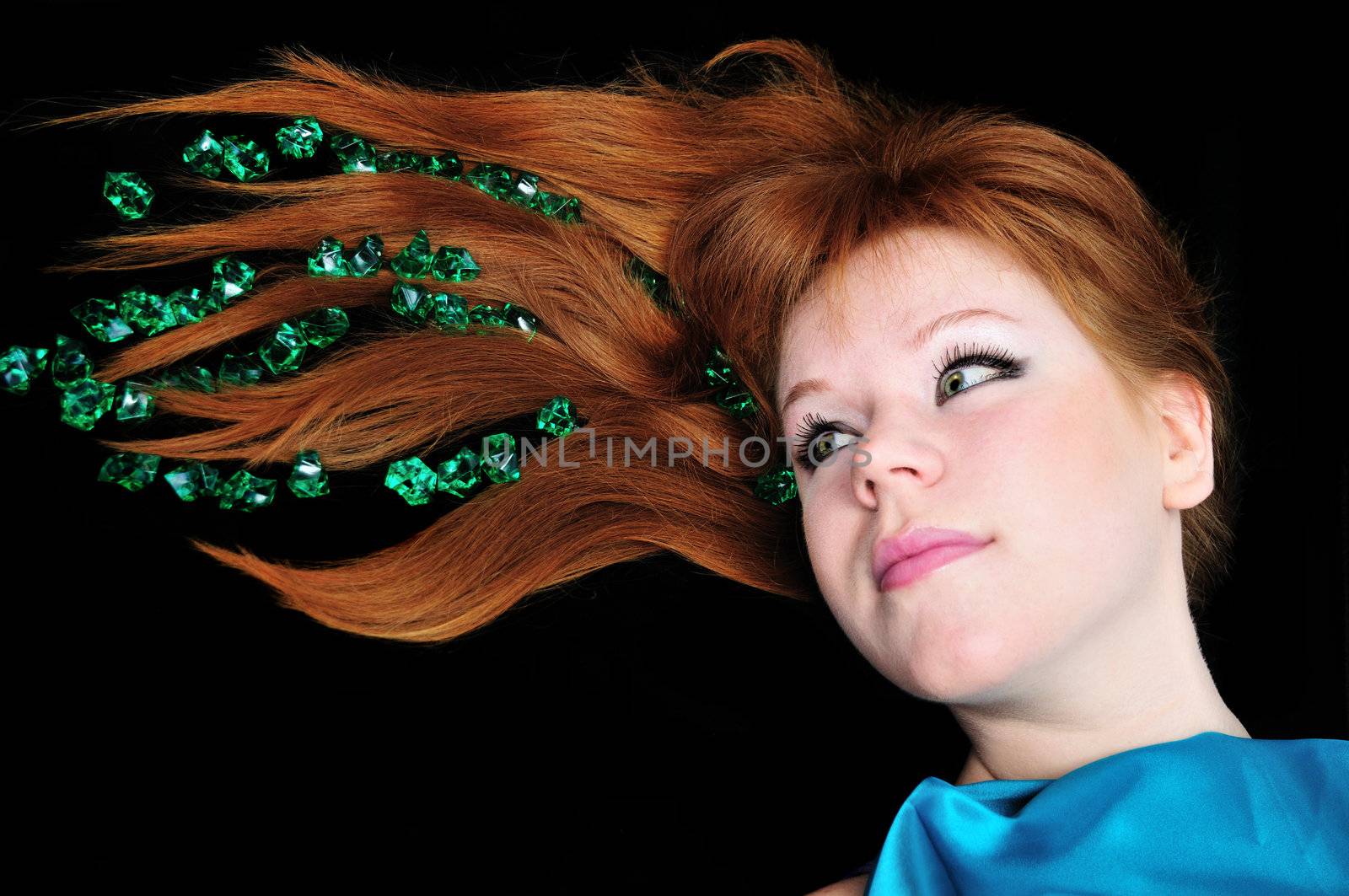  head of girl with natural red hair over black.