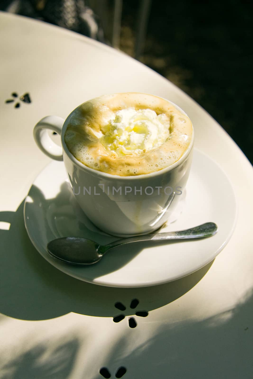 Cup of Cappuccino with crema and a heart symbol