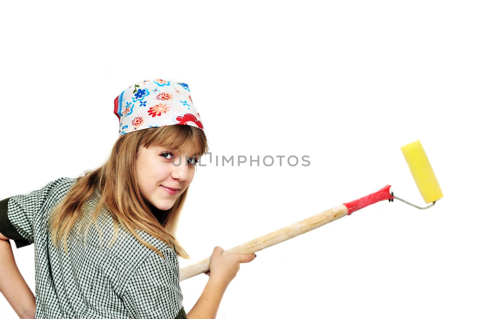   cute teenage girl  using roller to paint wall isolated  on the white background

