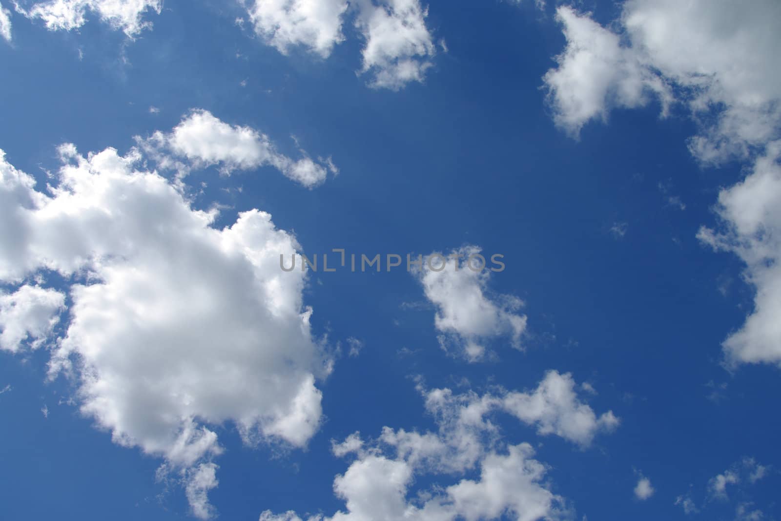 Clouds in a blue sky on a bright sunny day