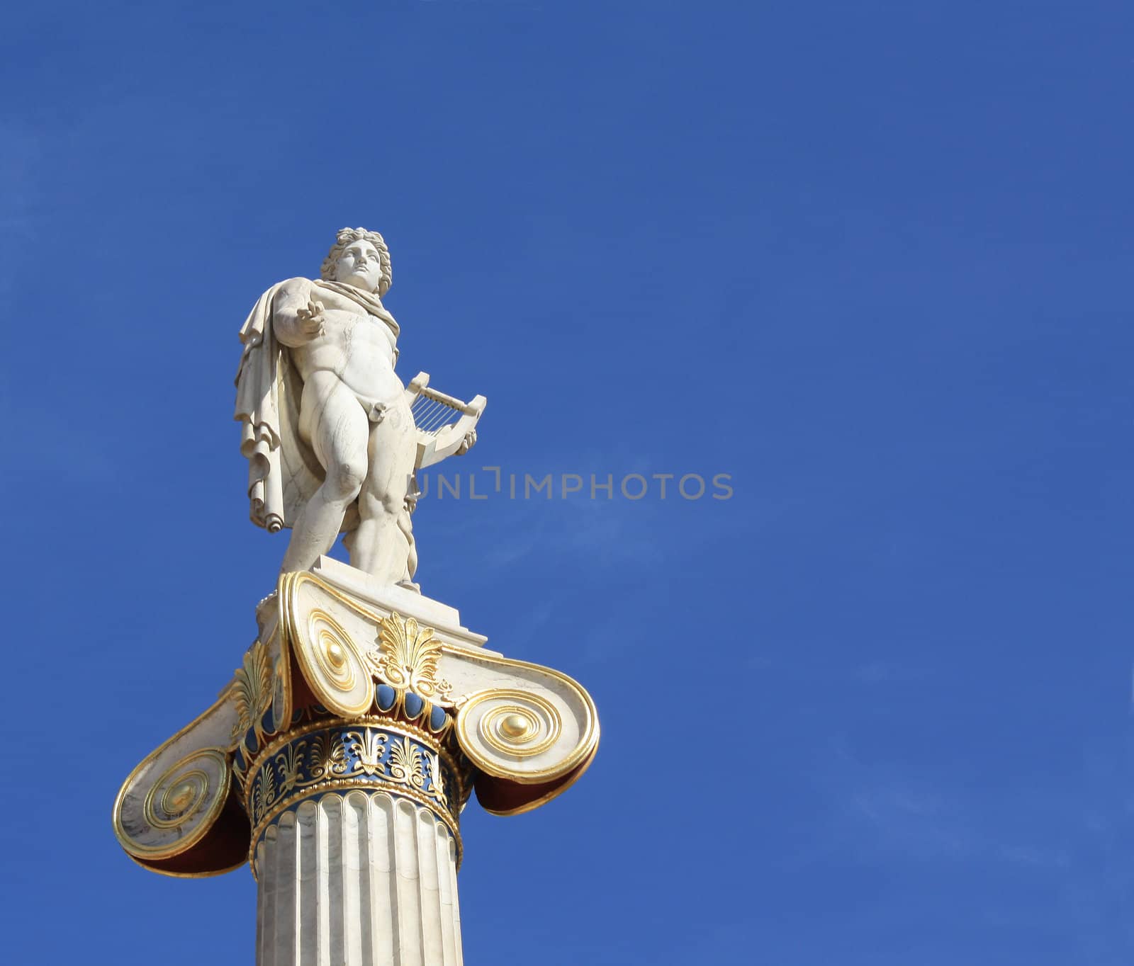 Neoclassical statue of ancient Greek god of the sun, Apollo, outside the Academy of Arts in Athens, Greece, with copyspace.