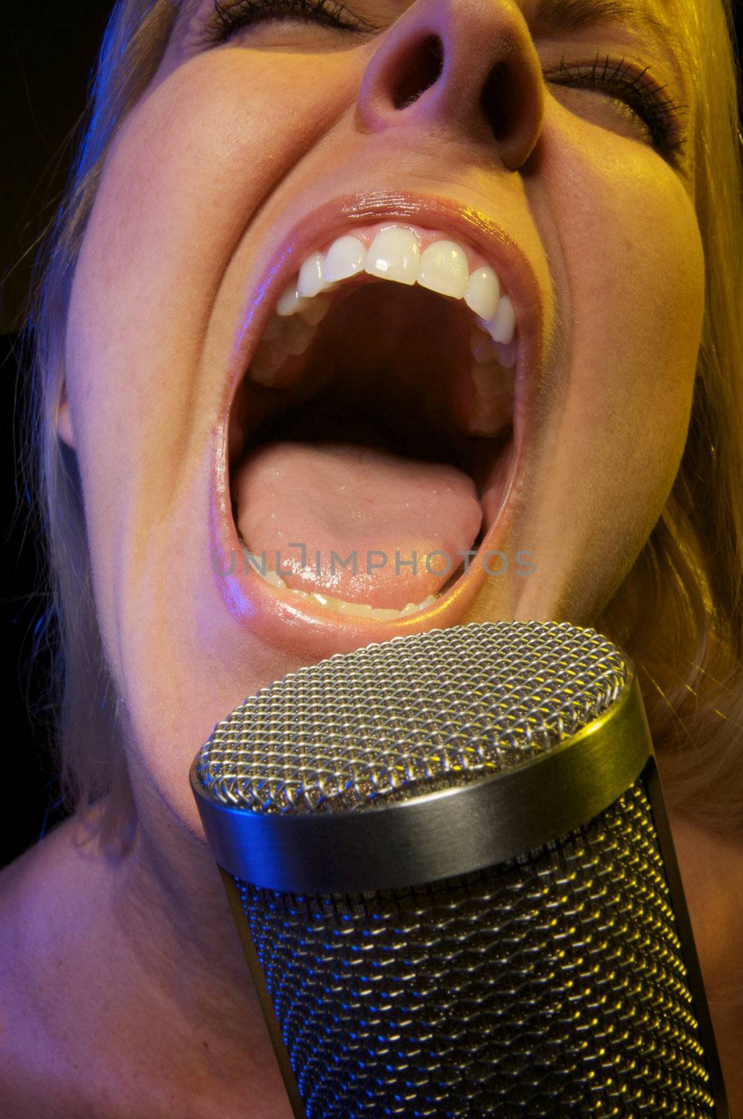 Woman with Microphone Sings with Passion