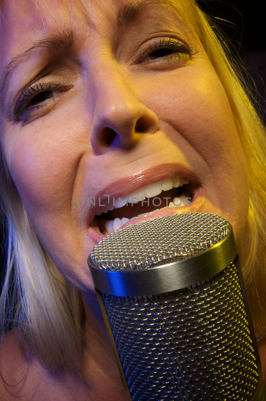 Woman with Microphone Sings with Passion