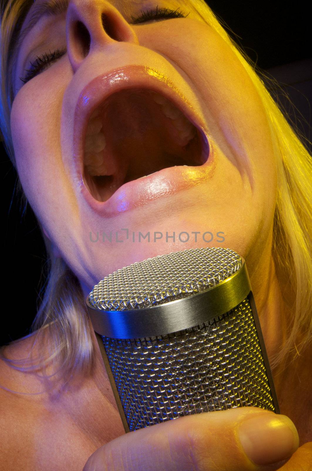 Woman with Microphone Sings with Passion