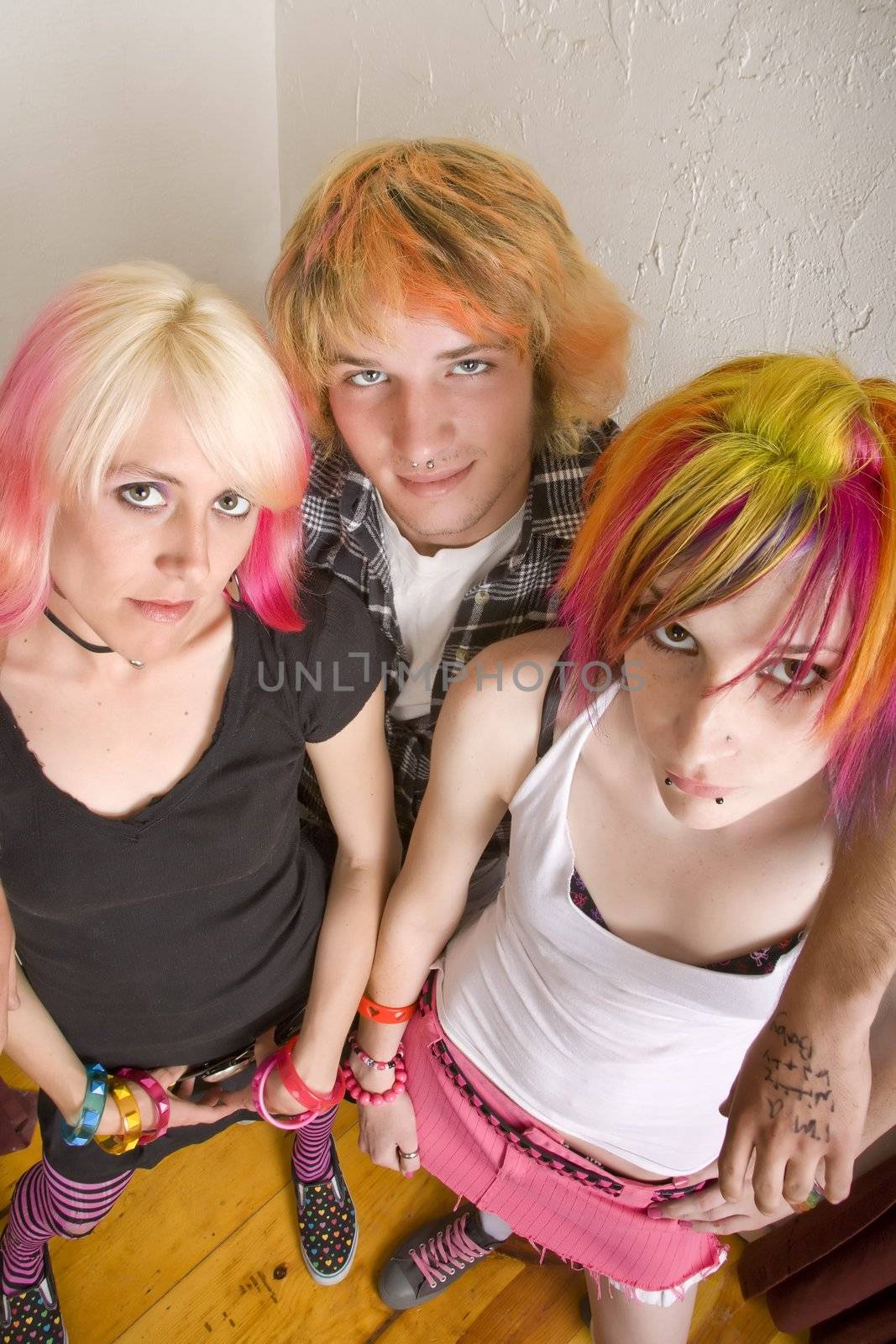 Three hip young people with brightly colored hair