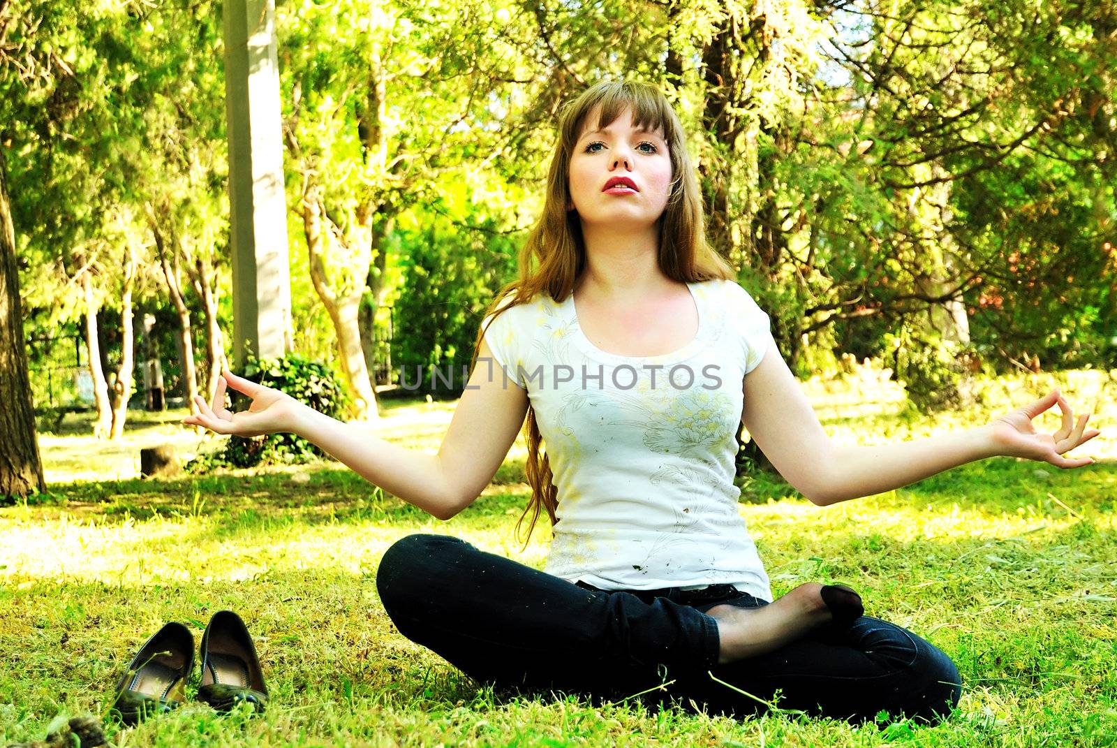 Beautiful girl relaxing in the park after work 