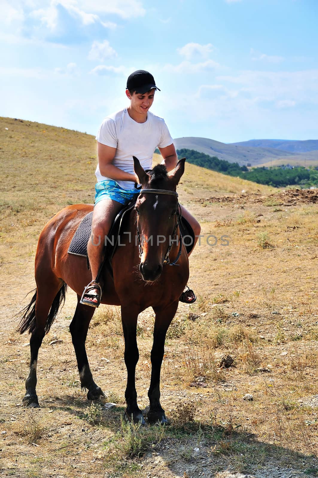 Man riding a horse, focus is on the horse's face