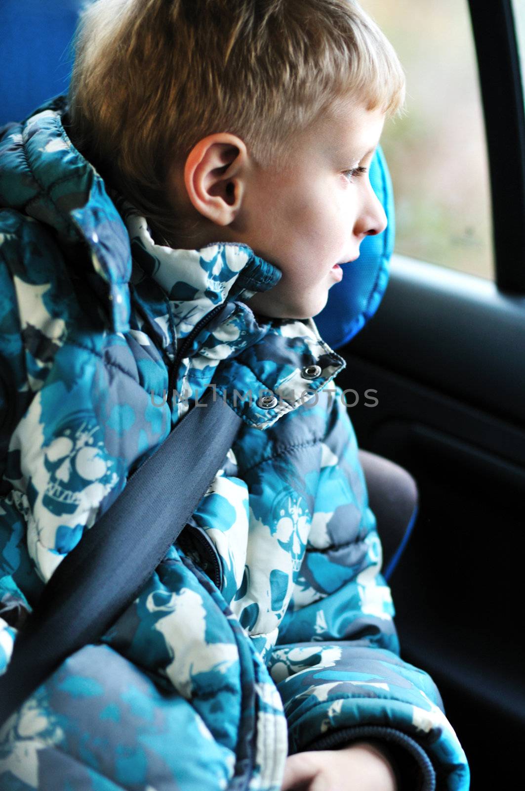 boy in carseat looking in the window
