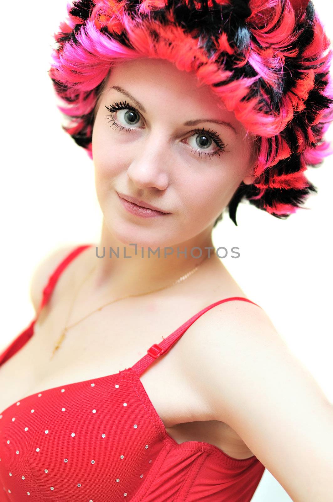 Beautiful smiling helloween  girl wearing red wig 
