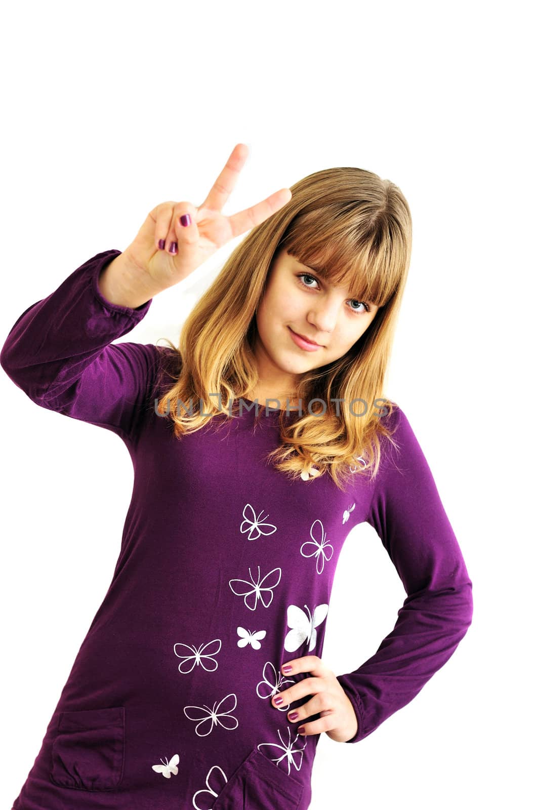lovely teen girl showing victory sign over the white
