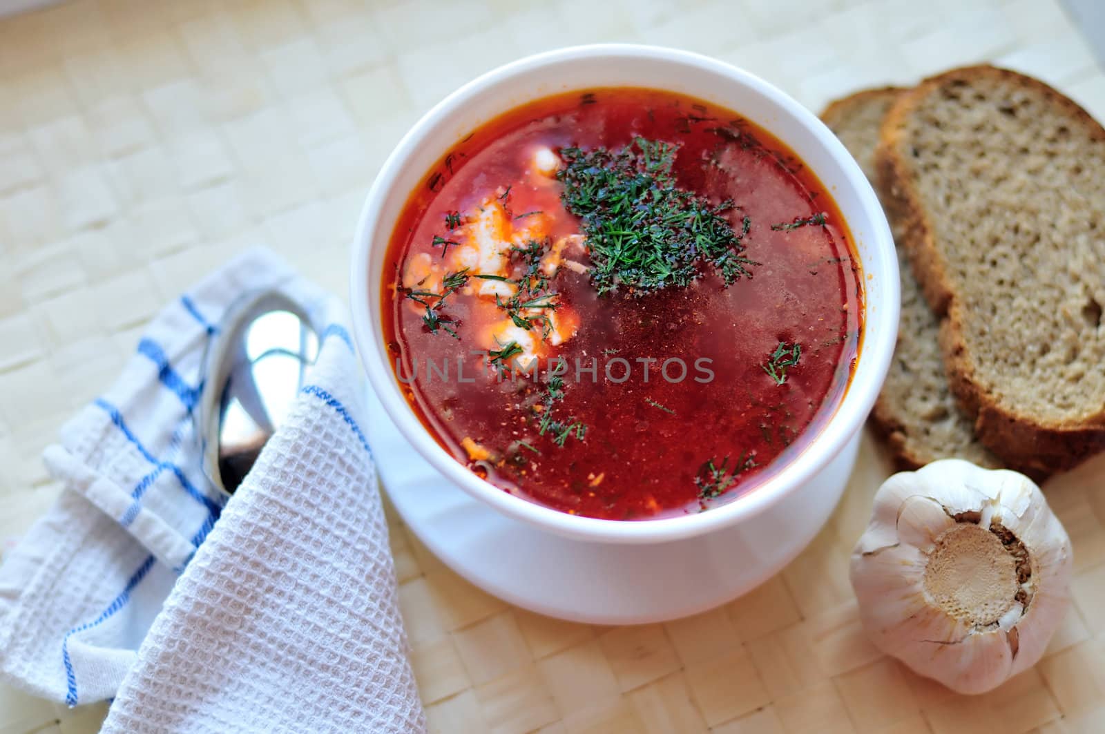 ukrainian and russian red-beet soup (borscht) with garlic and sour cream

